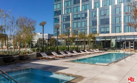 a view of a swimming pool with a lounge chairs