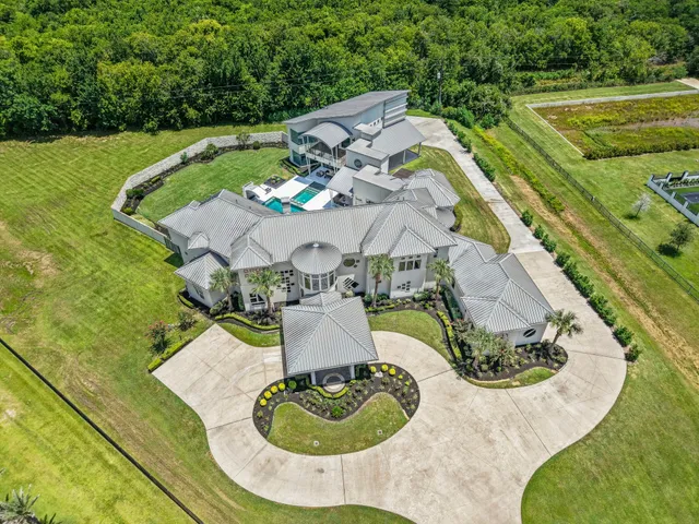 an aerial view of a house with outdoor space