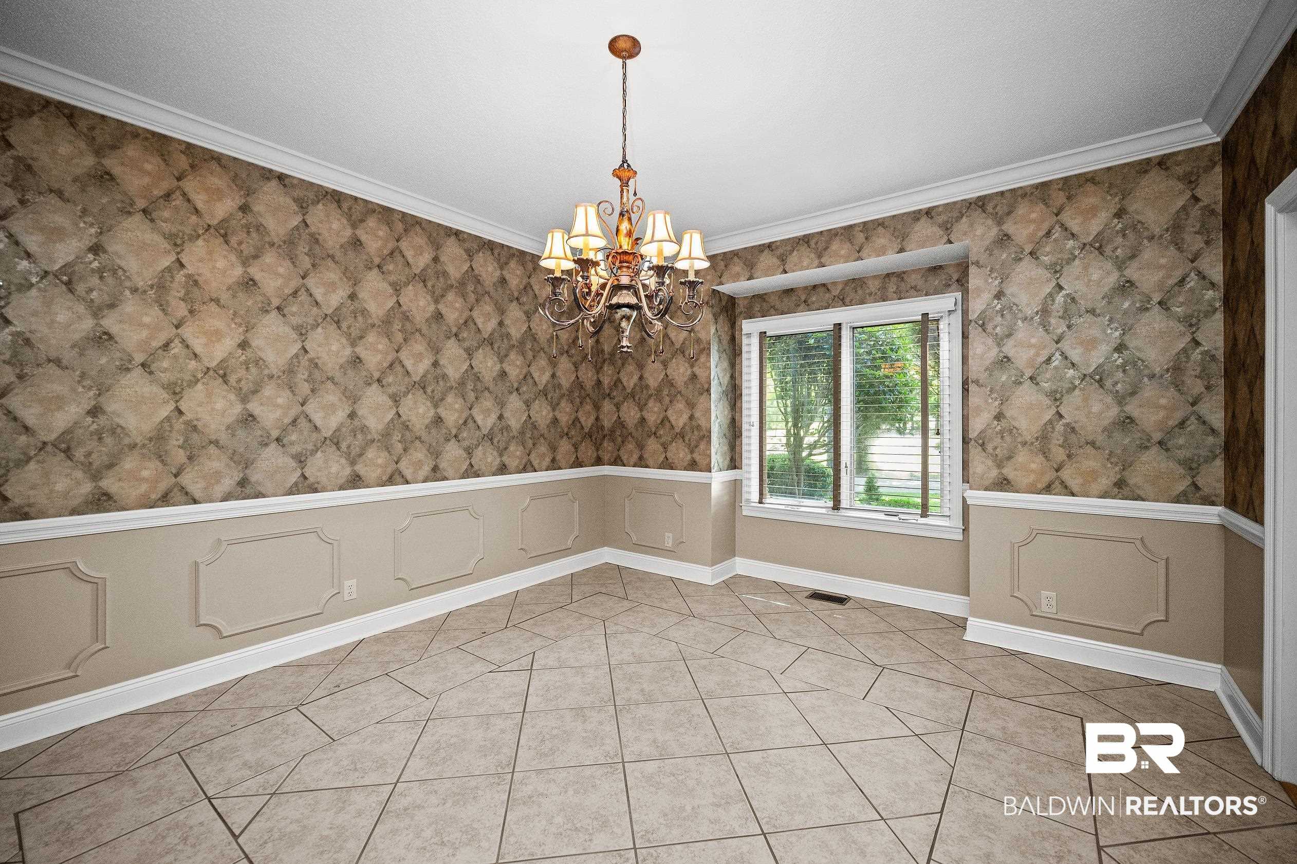 329 Norwood Road Monroeville, AL 36460 - Photo 4 of 49 Room featuring patterned wallpaper, wainscoting, crown molding, and tiled flooring