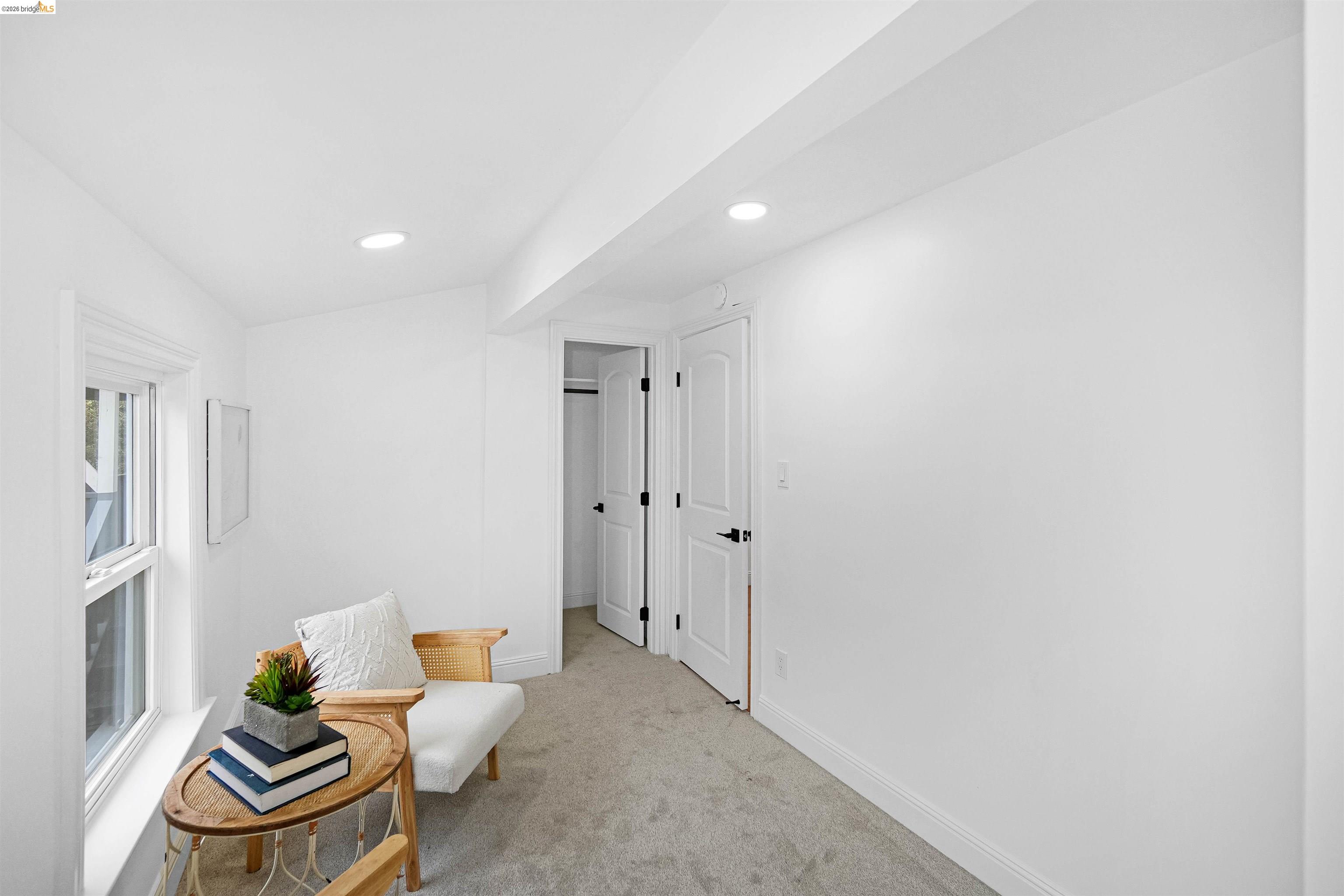 1812 Woolsey Street Berkeley, CA 94703 - Photo 22 of 48 Carpeted room featuring recessed lighting, a window with white trim, and white paneled doors with matte black hardware