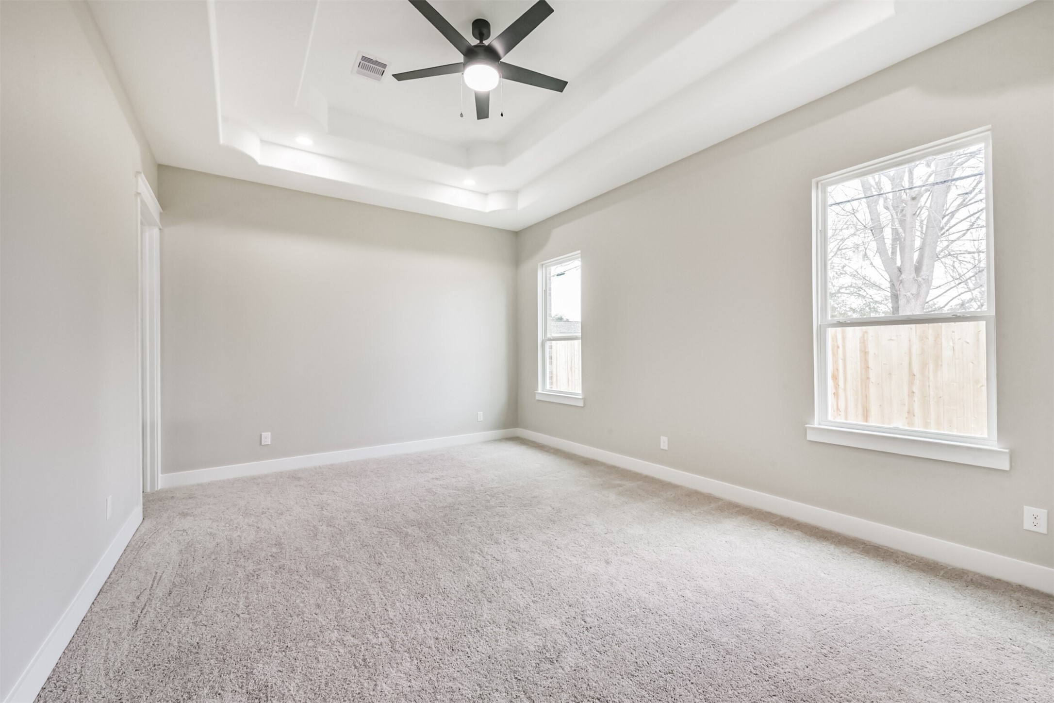 2803 Lancaster Lane Pasadena, TX 77506 - Photo 25 of 45 an empty room with windows and fan