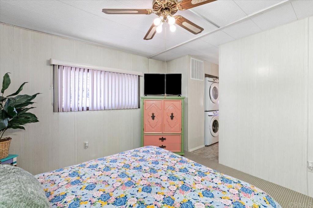 28890 Lilac Road, Unit 80 Valley Center, CA 92082 - Photo 15 of 33 a bedroom with a bed and a tv