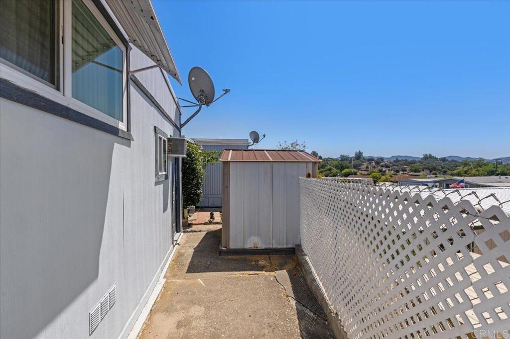28890 Lilac Road, Unit 80 Valley Center, CA 92082 - Photo 26 of 33 a view of a street with wooden fence