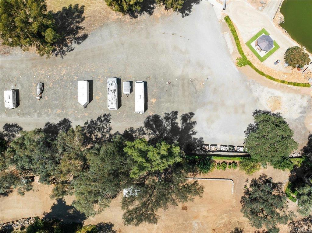 28890 Lilac Road, Unit 80 Valley Center, CA 92082 - Photo 30 of 33 a view of a lake with a building in the background