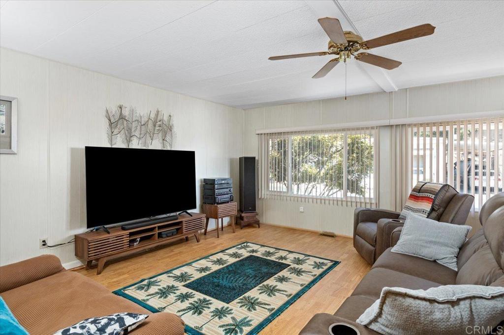 28890 Lilac Road, Unit 80 Valley Center, CA 92082 - Photo 3 of 33 a living room with furniture and a flat screen tv