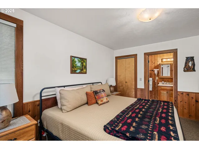 a bedroom with a bed and a dresser