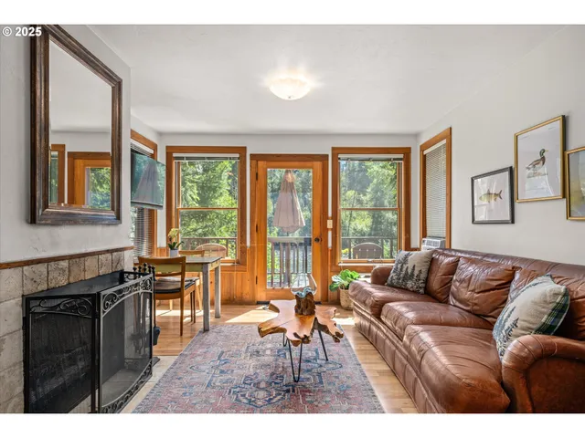 a living room with furniture and large windows