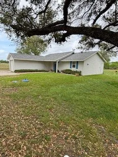 a view of a house with a garden