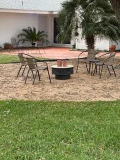 a view of swimming pool with outdoor seating and plants