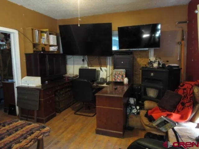 a room with furniture and flat screen tv