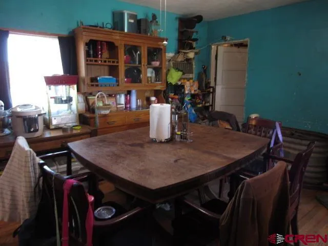 a bed room with a bed and a television