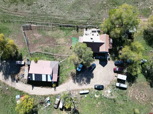 an aerial view of a house with outdoor space