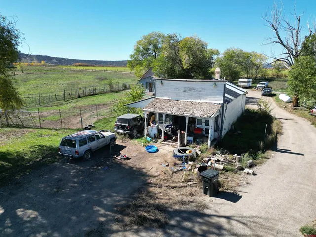 a aerial view of a house with a yard