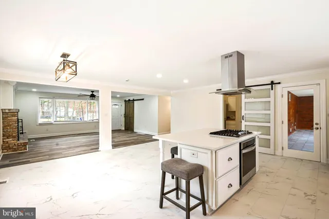 a kitchen with sink cabinets and stove top oven