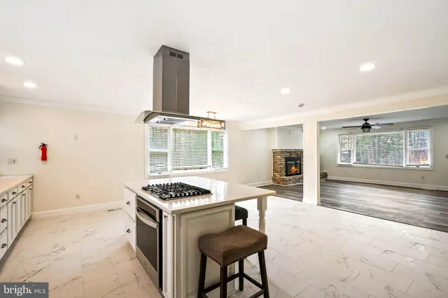 a kitchen with furniture and window