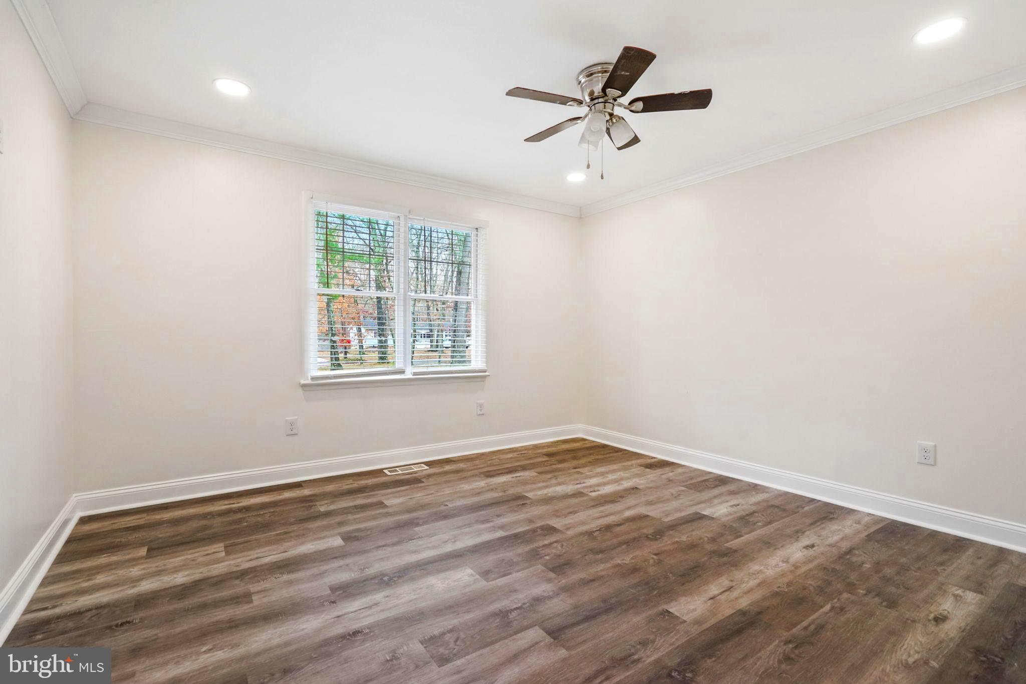 52 Summit Drive Tabernacle, NJ 08088 - Photo 13 of 27 wooden floor in an empty room with a window
