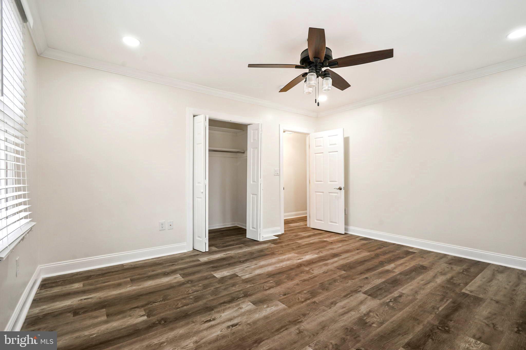 52 Summit Drive Tabernacle, NJ 08088 - Photo 16 of 27 an empty room with wooden floor ceiling fan and windows