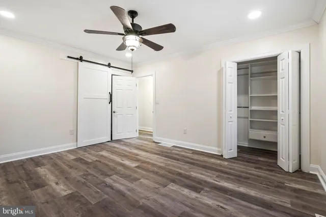 a view of a storage & utility room with wooden floor