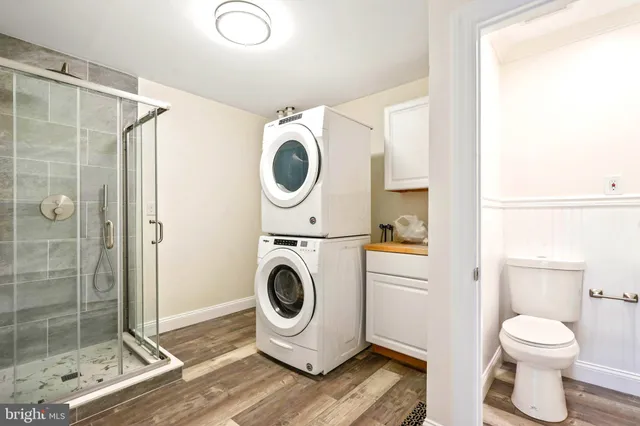 a bathroom with a toilet a sink and a shower