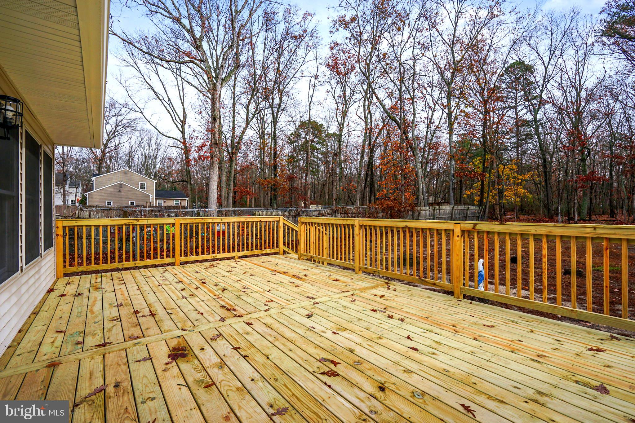 52 Summit Drive Tabernacle, NJ 08088 - Photo 24 of 27 a view of deck with wooden floor and fence next to a yard