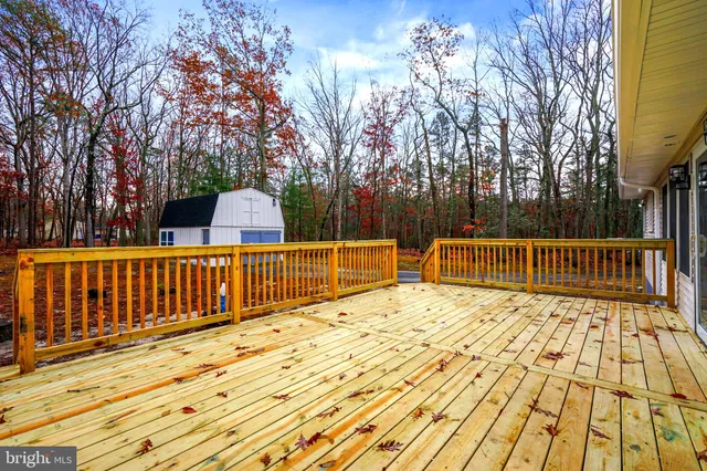 a backyard of a house with large trees