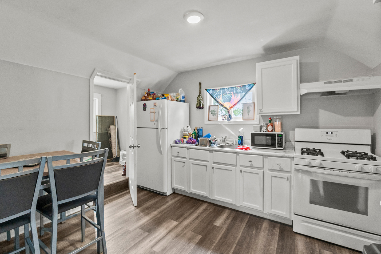 305 Irving Street Joliet, IL 60432 - Photo 17 of 20 a kitchen with a sink cabinets and wooden floor