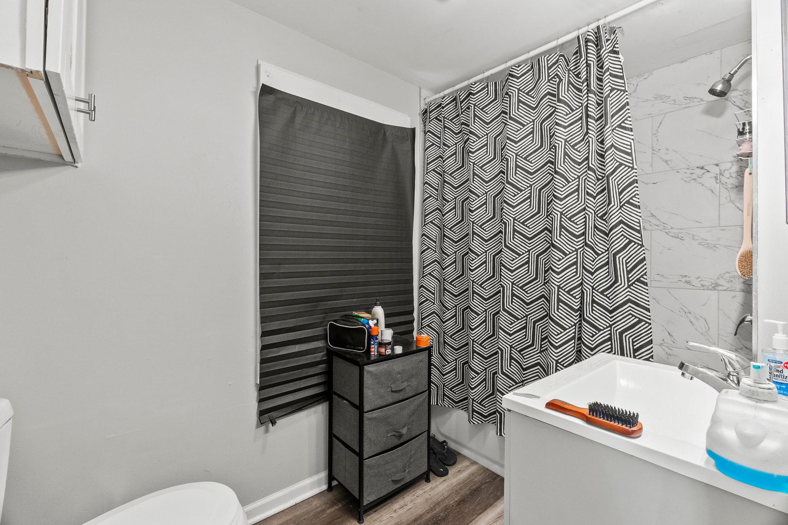 305 Irving Street Joliet, IL 60432 - Photo 9 of 20 a bathroom with a sink and a toilet