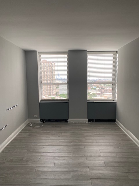 655 West Irving Park Road, Unit 2611 Chicago, IL 60613 - Photo 14 of 32 a view of an empty room with a window