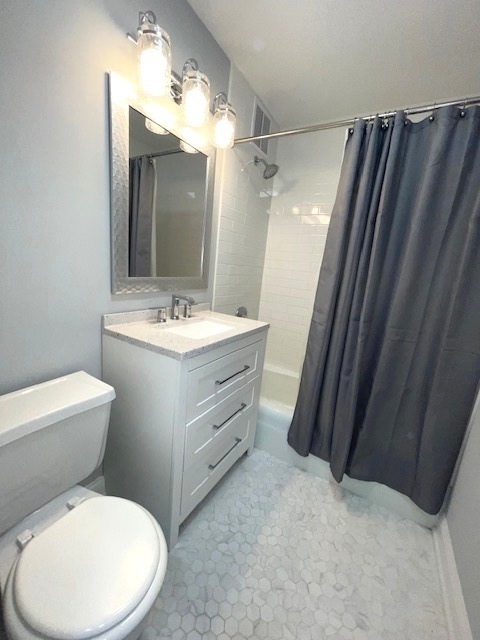 655 West Irving Park Road, Unit 2611 Chicago, IL 60613 - Photo 25 of 32 a bathroom with a toilet sink and mirror