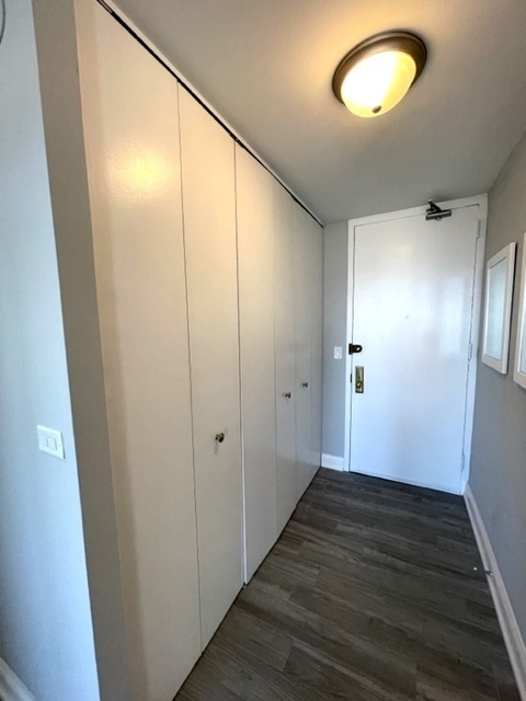 655 West Irving Park Road, Unit 2611 Chicago, IL 60613 - Photo 30 of 32 a view of hallway with wooden floor