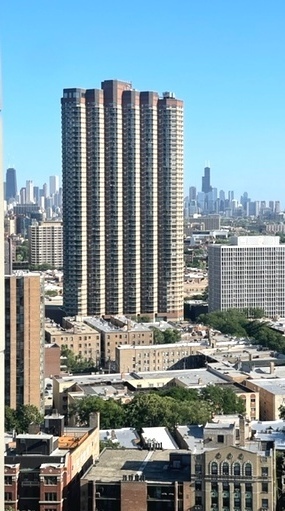 655 West Irving Park Road, Unit 2611 Chicago, IL 60613 - Photo 32 of 32 a city view with tall buildings