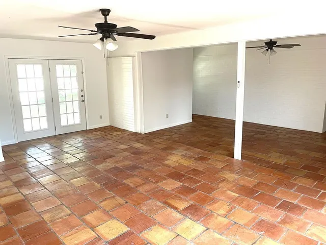 a view of house with backyard and porch