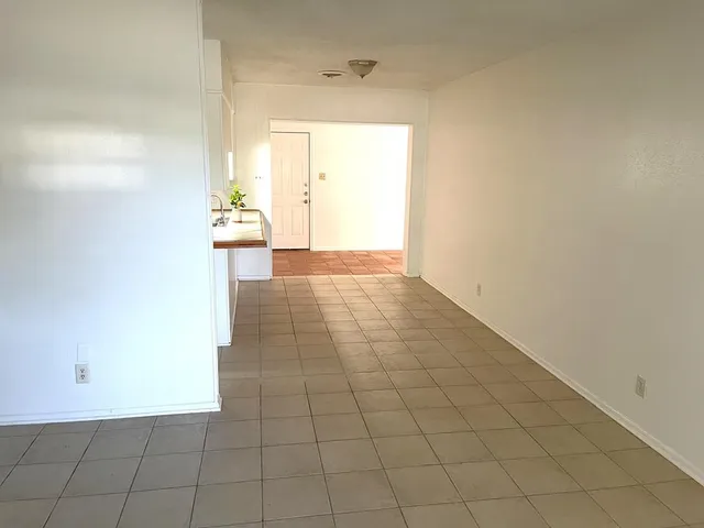 a view of an empty room and window