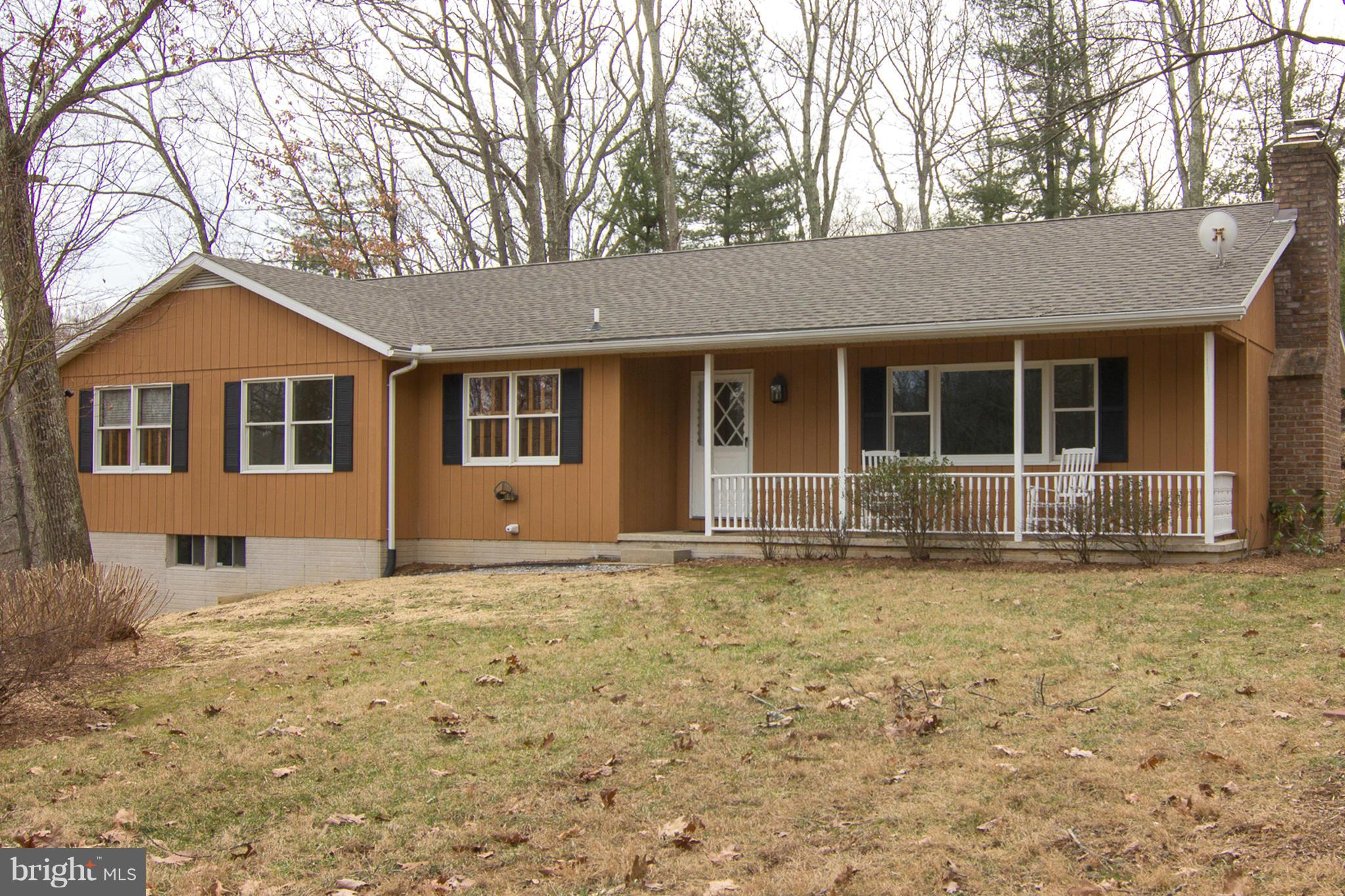 19306 Resh Mill Road Hampstead, MD 21074 - Photo 1 of 30 a house with trees in the background