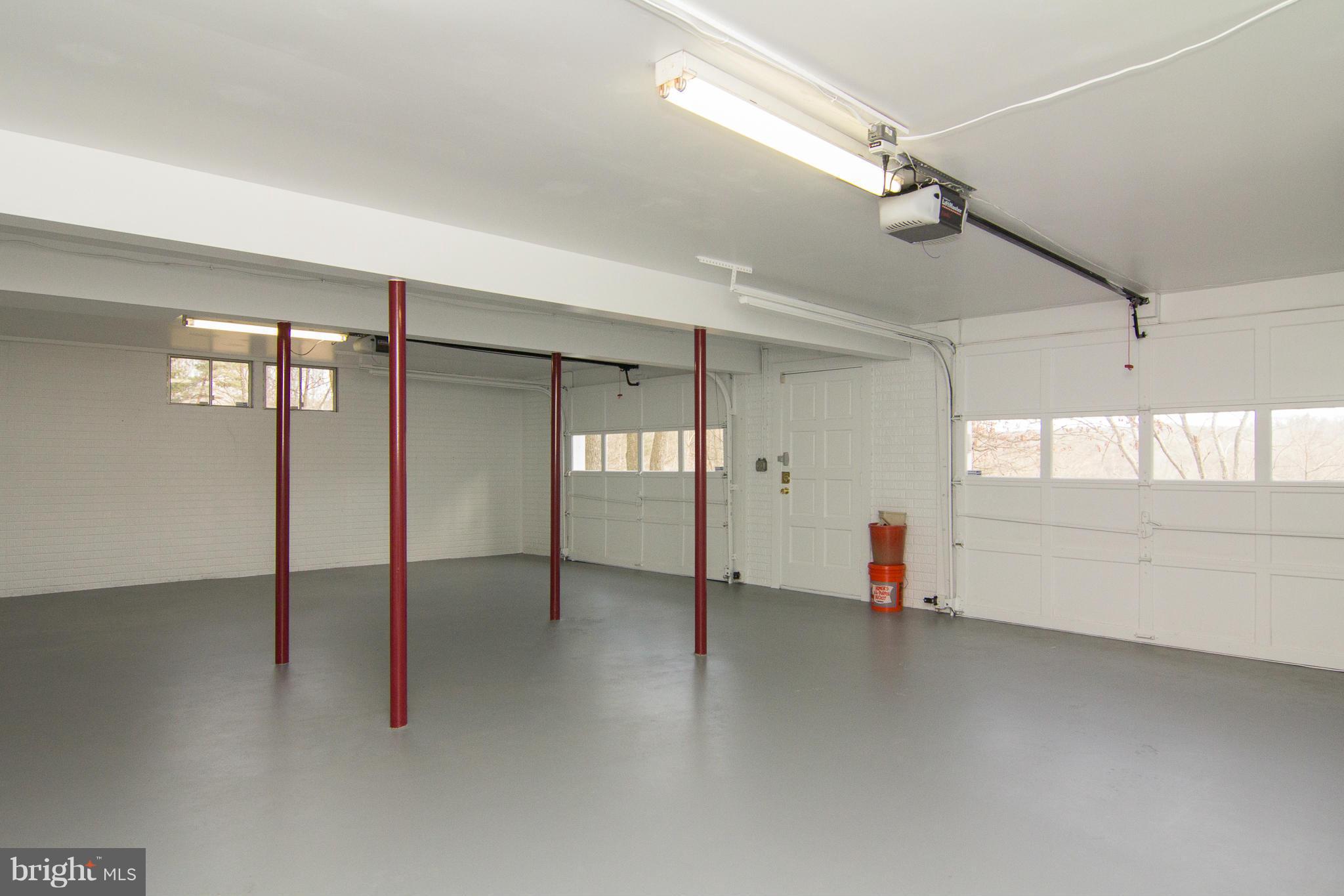 19306 Resh Mill Road Hampstead, MD 21074 - Photo 21 of 30 an empty room with windows and pillars in it