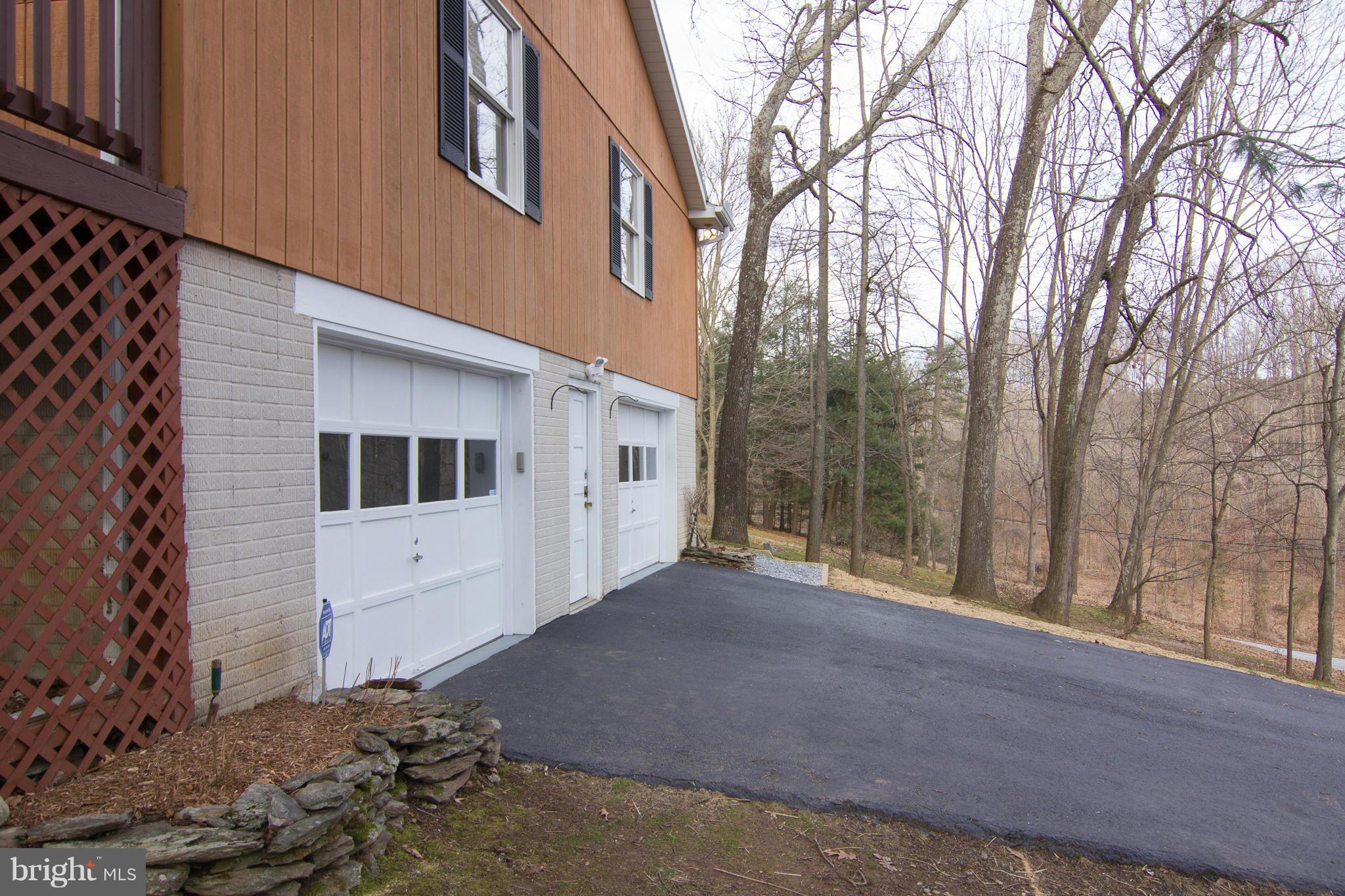 19306 Resh Mill Road Hampstead, MD 21074 - Photo 22 of 30 a front view of a house with a yard