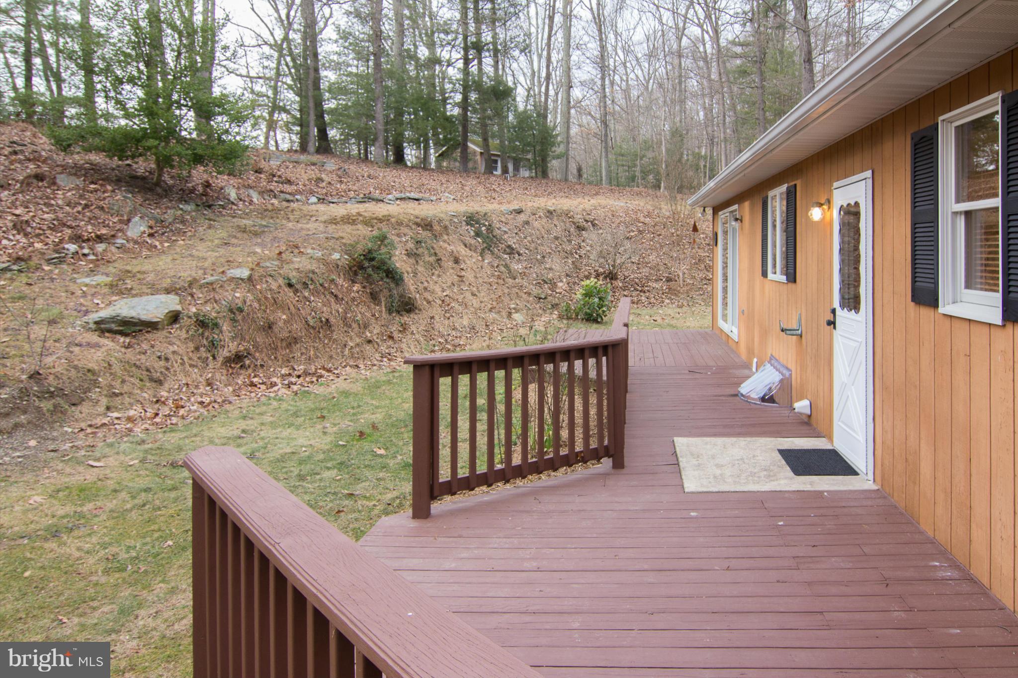 19306 Resh Mill Road Hampstead, MD 21074 - Photo 24 of 30 a balcony with wooden floor and outdoor space