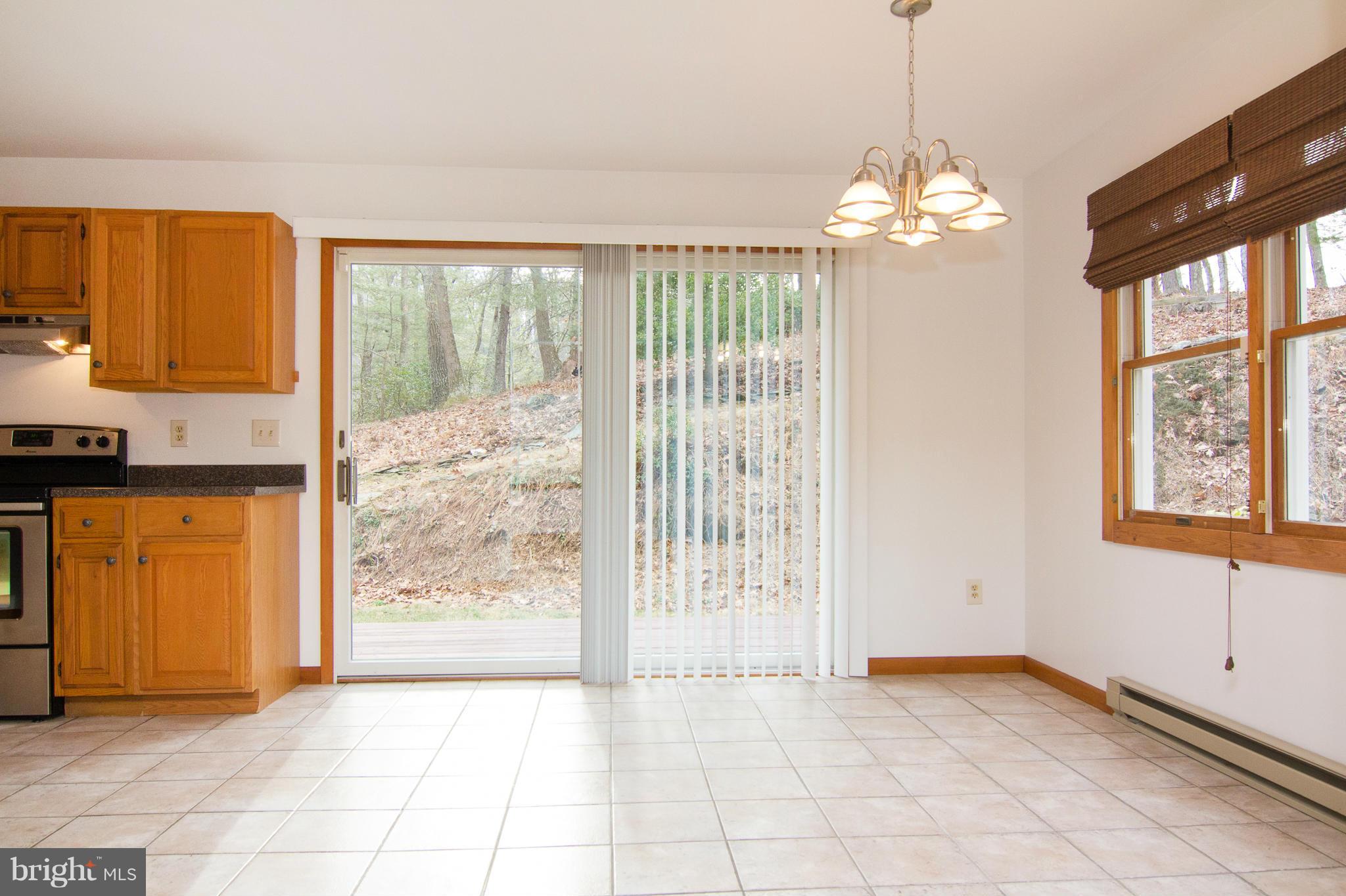 19306 Resh Mill Road Hampstead, MD 21074 - Photo 7 of 30 a view of an empty room with a window