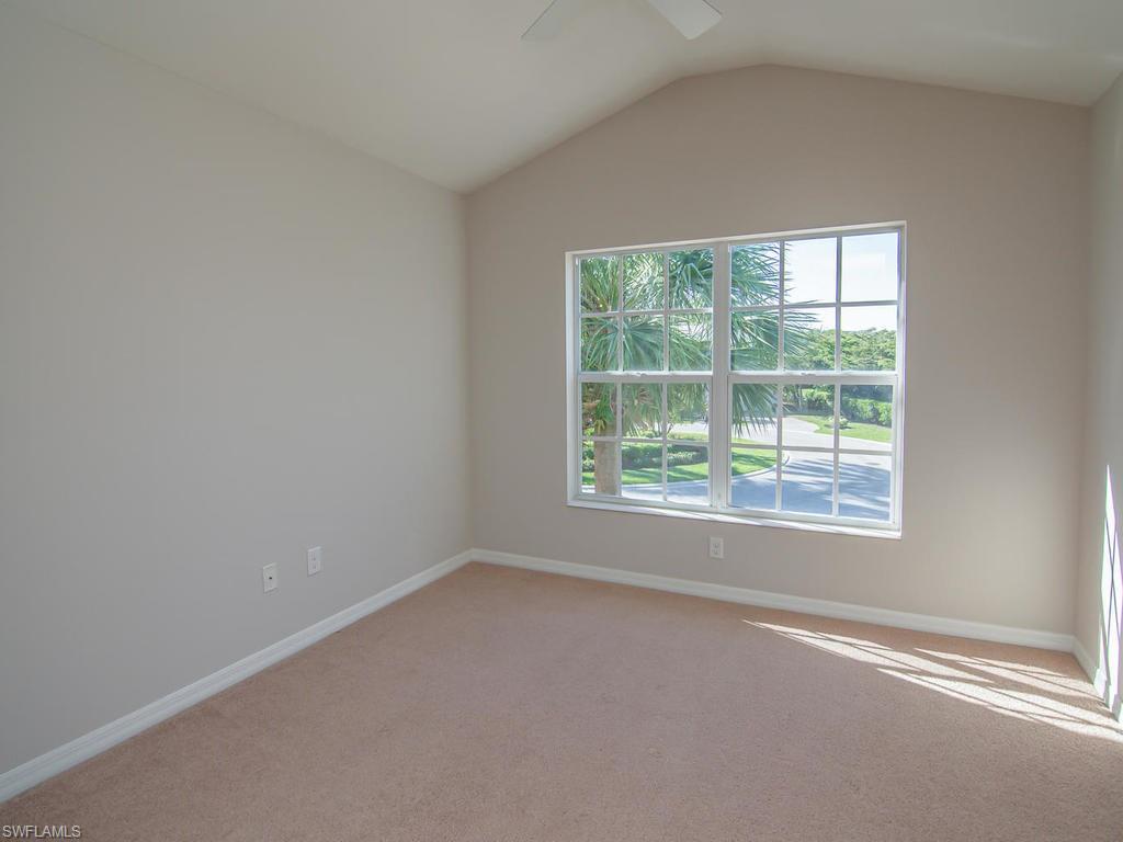 16170 Caldera Lane, Unit 37 Naples, FL 34110 - Photo 13 of 23 an empty room with a window