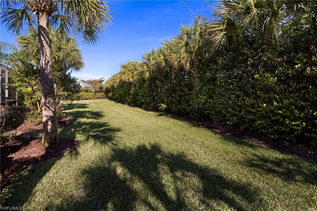 16170 Caldera Lane, Unit 37 Naples, FL 34110 - Photo 18 of 23 a view of a yard