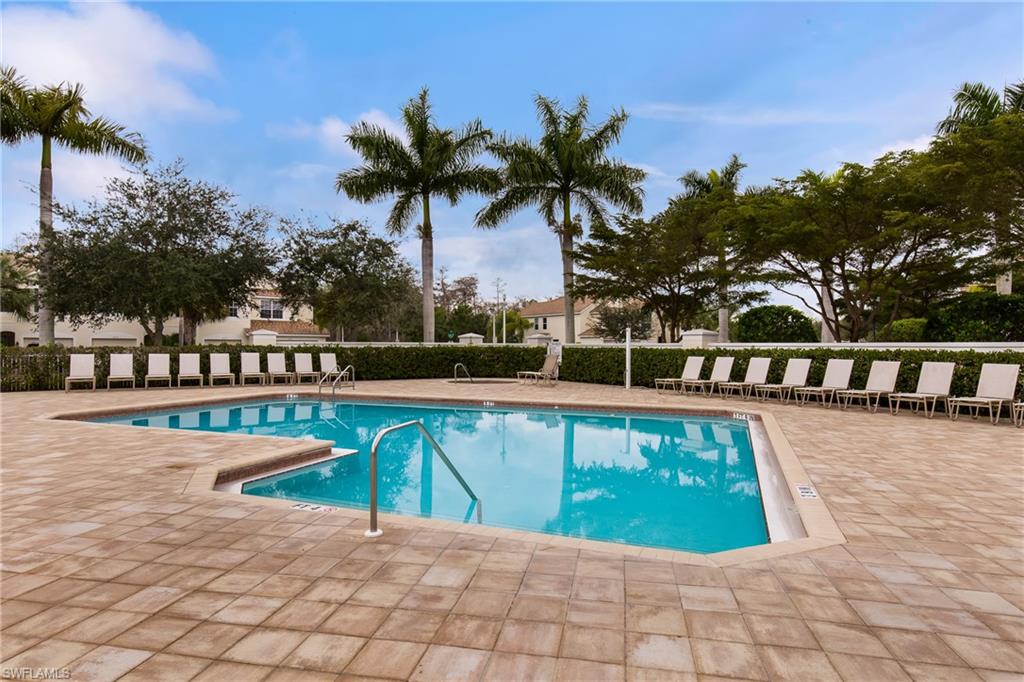 16170 Caldera Lane, Unit 37 Naples, FL 34110 - Photo 21 of 23 a view of swimming pool with lounge chair