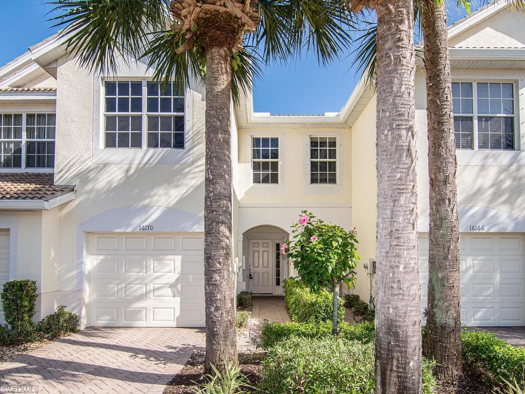 16170 Caldera Lane, Unit 37 Naples, FL 34110 - Photo 5 of 23 a front view of a house with garden