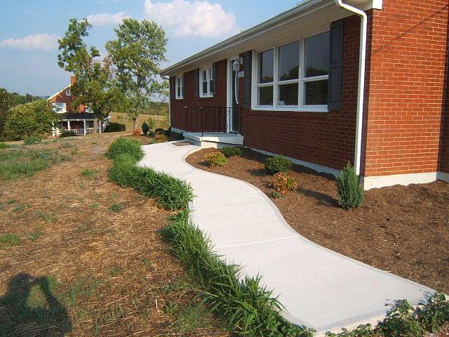 1161 Blankenship Road Goodview, VA 24095 - Photo 11 of 12 a backyard of a house with yard and outdoor seating