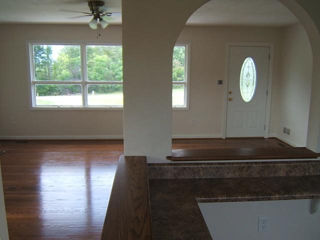 1161 Blankenship Road Goodview, VA 24095 - Photo 3 of 12 a view of a livingroom with wooden floor and a large window