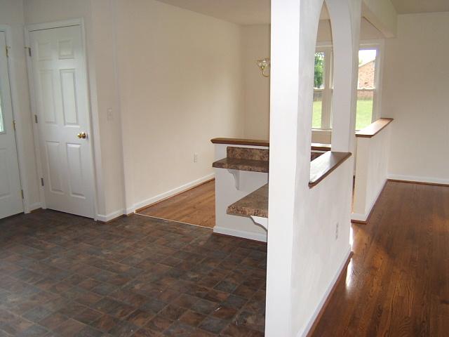 1161 Blankenship Road Goodview, VA 24095 - Photo 4 of 12 wooden floor in an empty room with a window