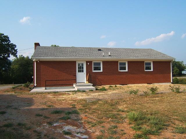 1161 Blankenship Road Goodview, VA 24095 - Photo 10 of 12 a house that has a tree in front of it