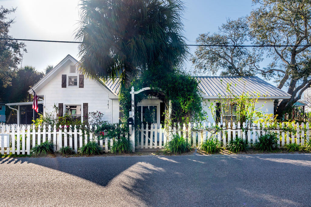 141 Miami Street Miramar Beach, FL 32550 - Photo 24 of 31 a view of a white house with a small yard and plants