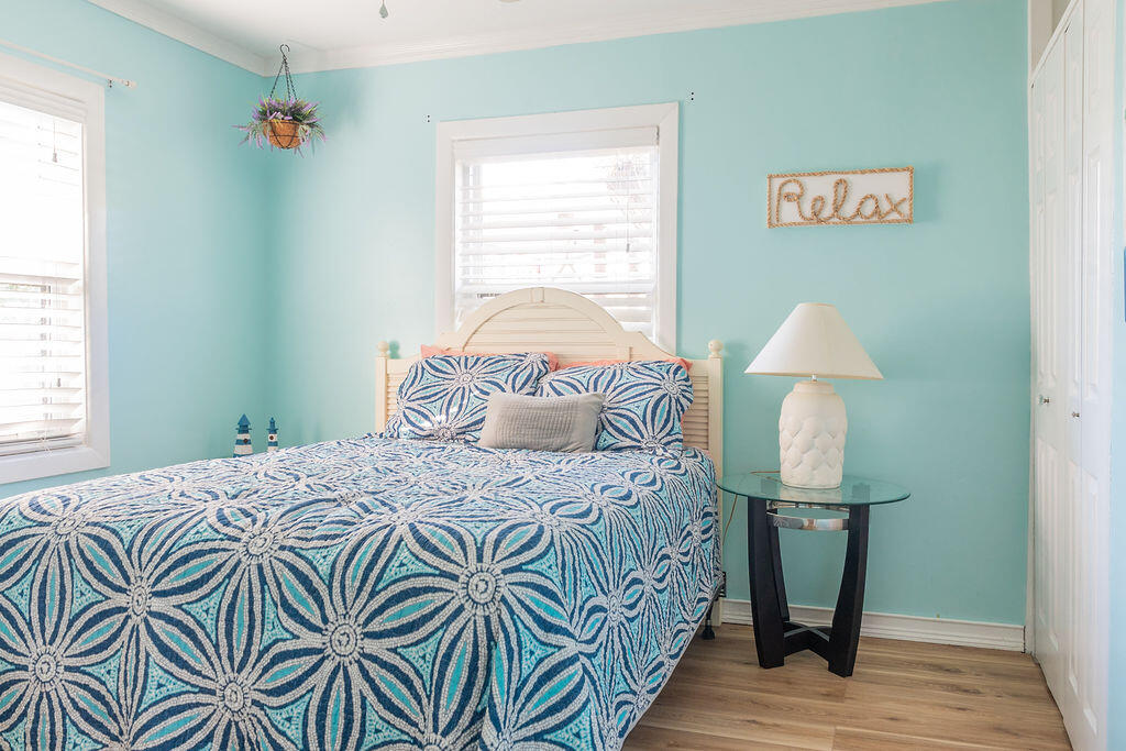 141 Miami Street Miramar Beach, FL 32550 - Photo 7 of 31 a bedroom with a bed and a lamp on table