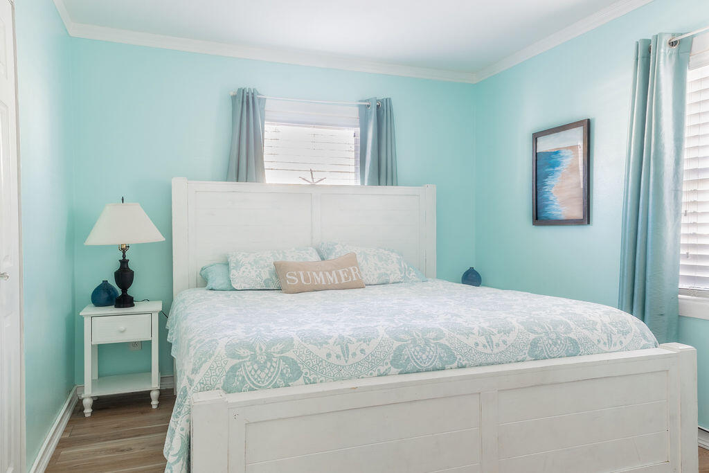 141 Miami Street Miramar Beach, FL 32550 - Photo 8 of 31 a bedroom with a bed and a lamp on table