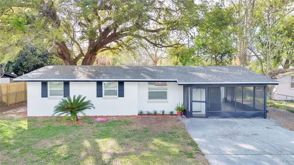 a view of a house with a yard
